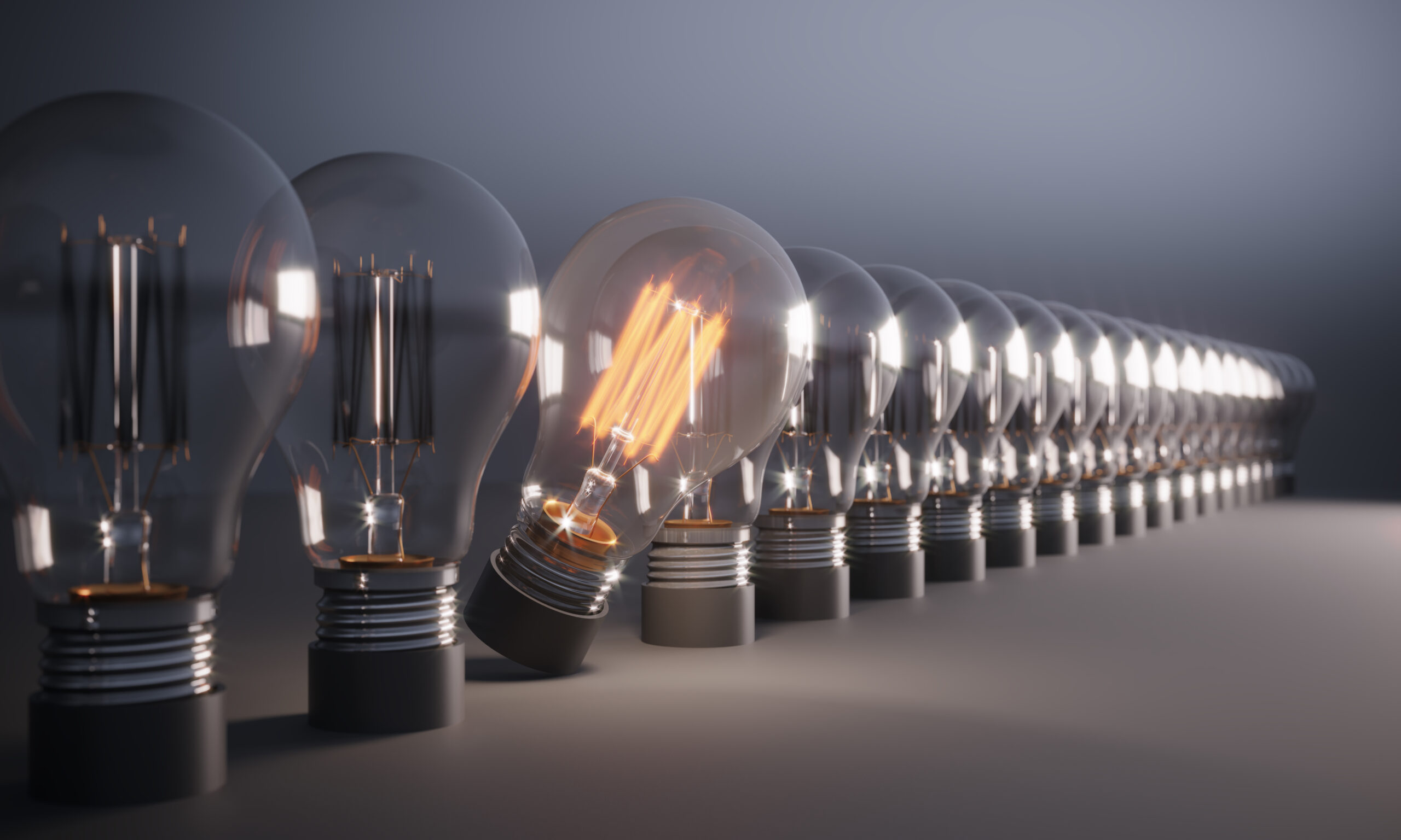 Glowing Light Bulb between the others. Can be used leadership, innovation and individuality concepts. (3d render)